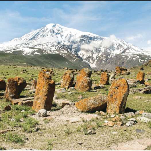 Mount Ararat overlooking a field of eroded khachkars (Armenian cross-stones) in Western Armenia, from the book ‘100 (1915-2015)'.