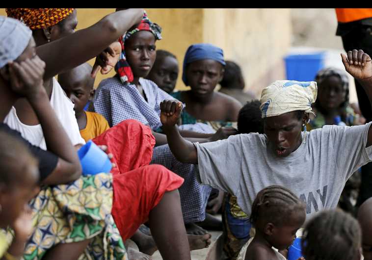 A woman rescued from Boko Haram in Sambisa forest celebrates her freedom from Boko Haram at Malkohi camp for Internally Displaced People in Yola, Adamawa State, Nigeria