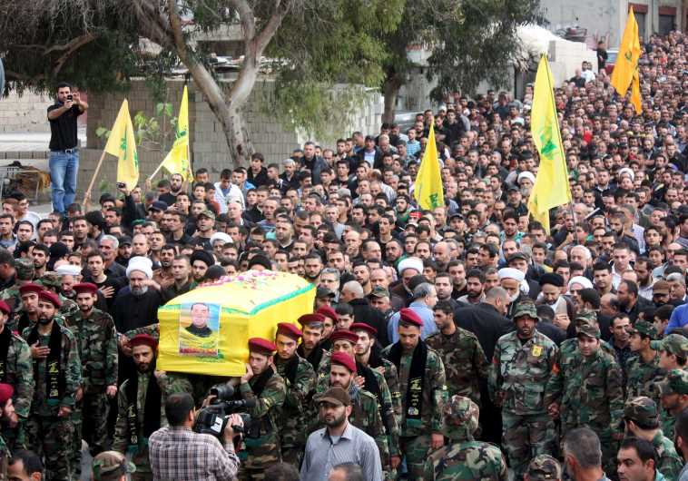 Hezbollah members in Lebanon take part in a funeral procession for their comrade Akram Sadek Hourani, who was killed in the recent battles in Syria's Qalamoun region.