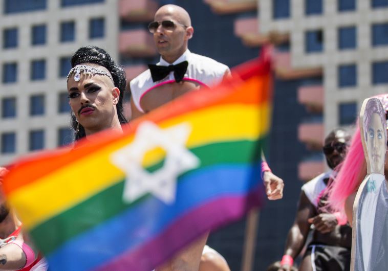 Israeli drag queens and go-go dancers dance on a truck during the annual gay pride parade in the Israeli coastal city of Tel Aviv on June 13, 2014.