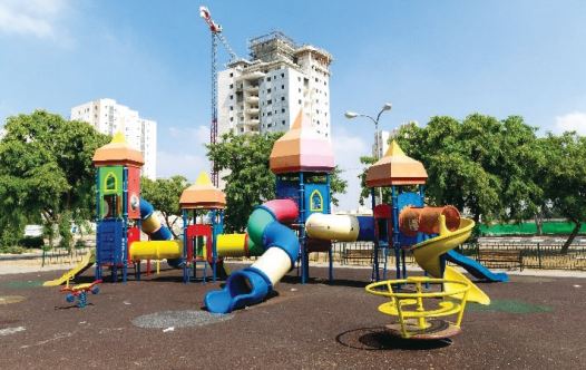 Playground in Kiryat Gat with little shade.