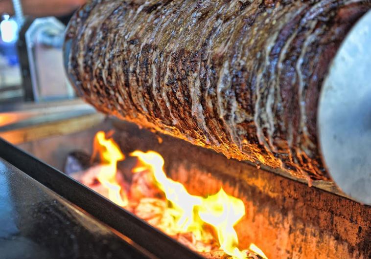 Shawarma roasting over coals at Bandura in Bnei Brak