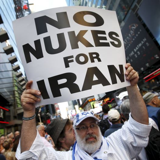 A man holds up a sign as he and several thousand other protestors demonstrate during a rally opposing the nuclear deal with Iran in Times Square