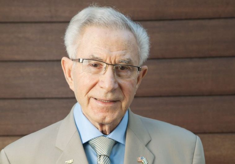 Holocaust survivor Ben Lesser with his memoir.