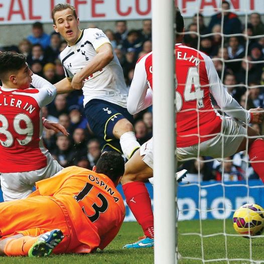 Harry Kane of Tottenham Hotspur scores against Arsenal during their English Premier League soccer match at White Hart Lane, London, in February