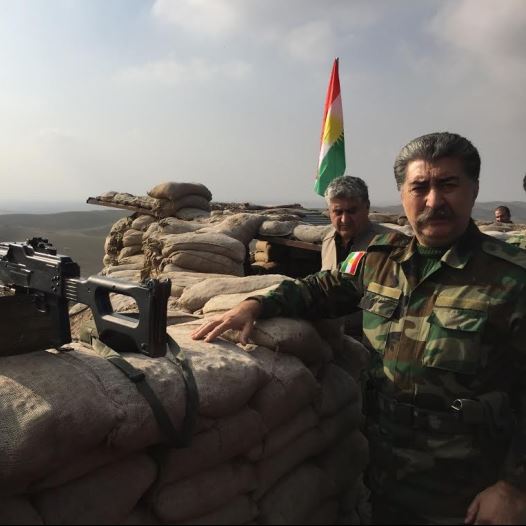 Hussein Yazdanpana, vice-president of the Kurdistan Freedom Party, speaking at the frontline with ISIS northeast of Kirkuk