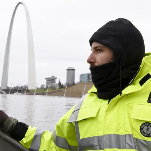 US Geological Survey (USGS) hydro technician Jason Carron assesses the Mississippi River flood waters in St. Louis