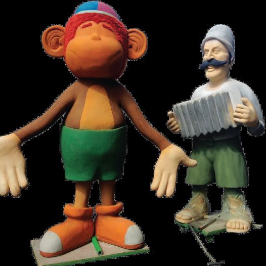 Zionist pioneer character Jacek from ‘Zehu Zeh,’ standing next to Kofiko the monkey from the children’s series of the same name