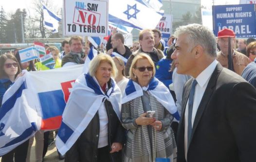 Yesh Atid Chairman Yair Lapid attends a pro-Israel rally in front of the UN Human Rights Council in Geneva in March