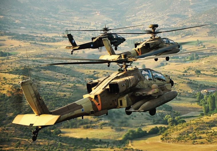 An Israel Air Force Apache helicopter lands across from a Greek mountain range during a joint Israel-Greece exercise with the Hellenic Air Force in October 2011