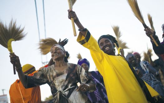Members of the Black Hebrews dance as they take part in celebrations for Shavuot in Dimona