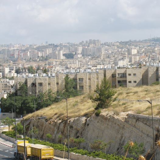 The Jewish neighborhood of Neveh Ya’acov with the settlement of Psagot in the background