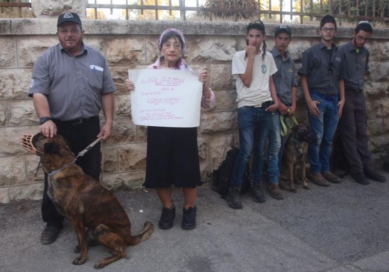 Mike Ben Yaakov, commander of the Israeli Dog Unit (left) stands next to Shifra Hoffman, founder of Victims Against Arab Terror International at a protest in front of the Prime Minister’s Residence in Jerusalem on Thursday evening.