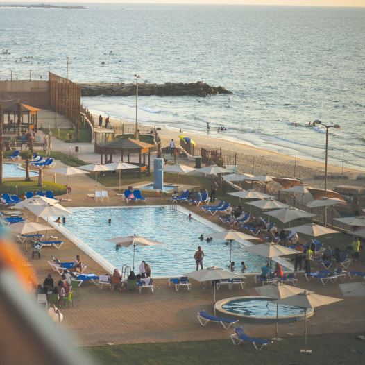 Palestinians are seen at the Blue Beach Resort in Gaza shortly after it opened in July 2015