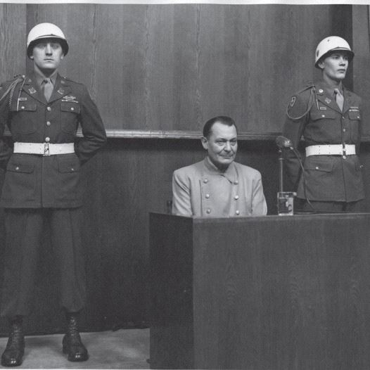 Hermann Goering, pictured at the 1945 Nuremberg Trials, was described by an American warden as a ‘simpering slob’