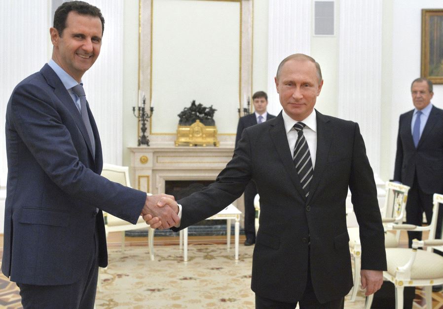 RUSSIAN PRESIDENT Vladimir Putin (right) shakes hands with Syrian President Bashar Assad during a meeting at the Kremlin in Moscow in 2015.