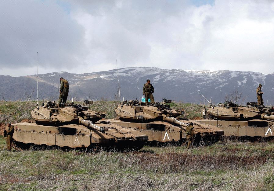 IDF tanks are seen along the Golan Heights border with Syria.