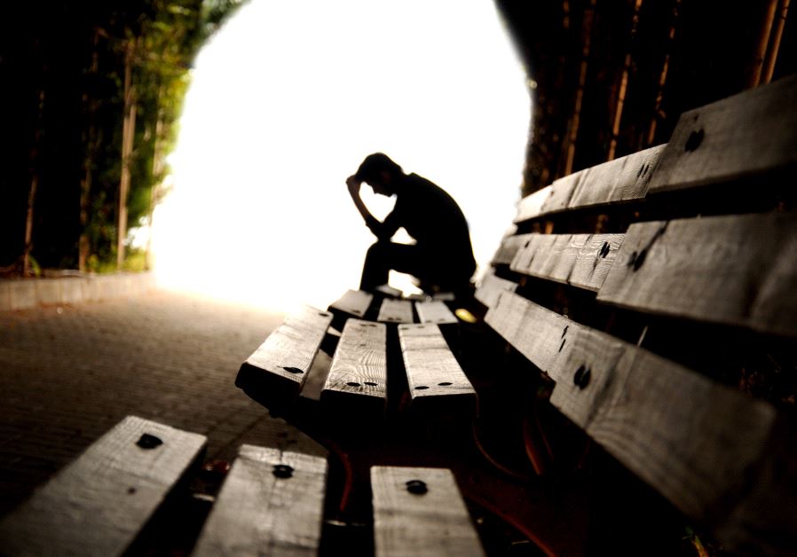 Sad person in tunnel (illustrative)