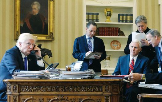 President Donald Trump, joined by (left to right) Chief of Staff Reince Priebus, Vice President Mike Pence, senior adviser Steve Bannon, Communications Director Sean Spicer and National Security Advisor Michael Flynn