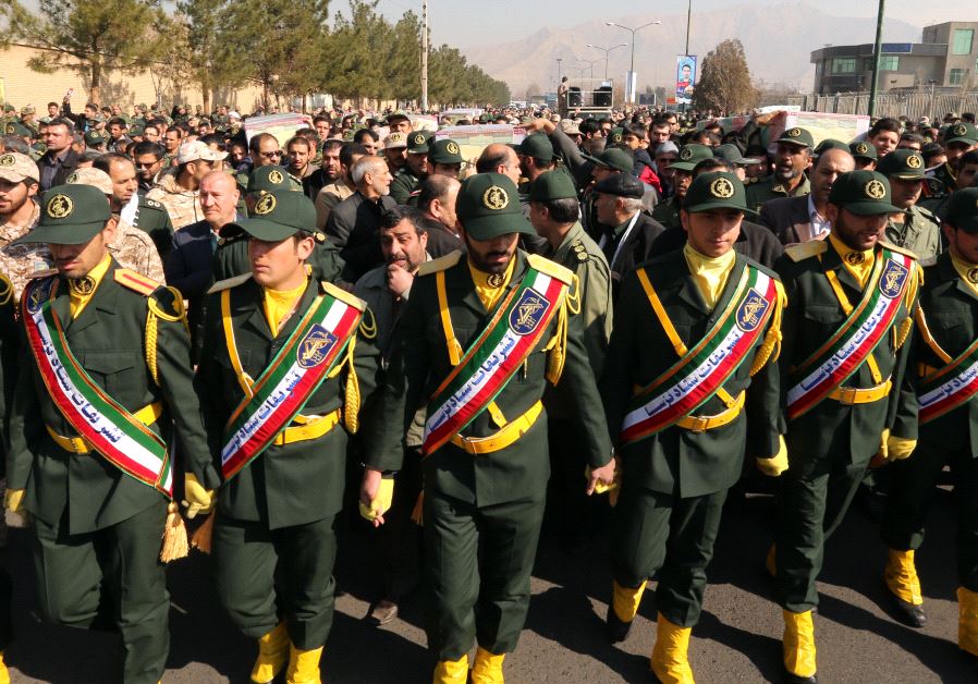 Iranian Revolutionary Guard members in Tehran carry the casket of Iran Revolutionary Guards Brigadier General Mohsen Ghajarian, who was killed in the northern province of Aleppo , Syria
