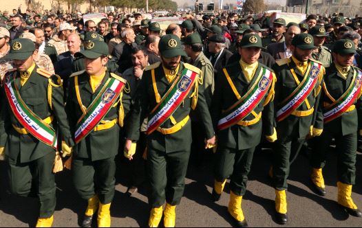 Iranian Revolutionary Guard members in Tehran carry the casket of Iran Revolutionary Guards Brigadier General Mohsen Ghajarian, who was killed in the northern province of Aleppo , Syria