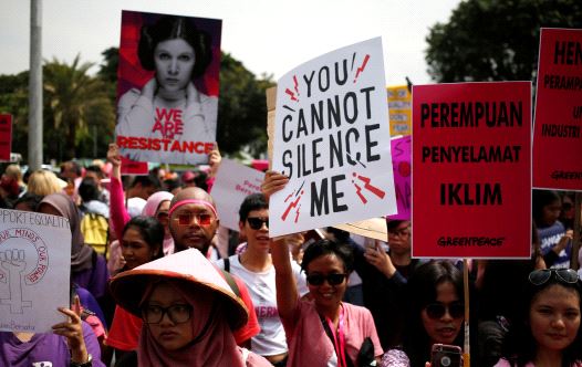 People take part in a rally calling for women's rights and equality ahead of International Women's Day in Jakarta, Indonesia, March 4, 2017