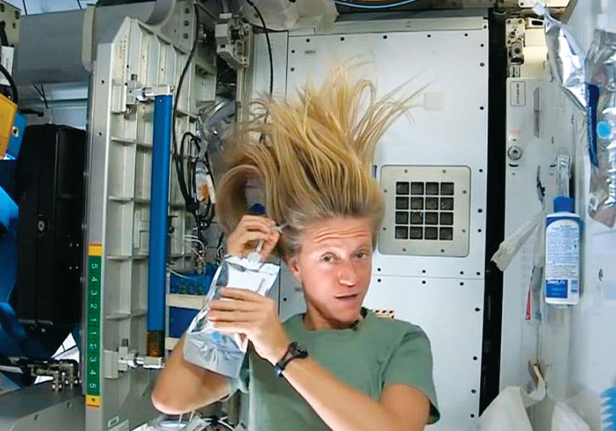 Nasa astronaut Karen Nyberg demonstrates how she washes her hair in zero gravity in outer space during a mission in 2013