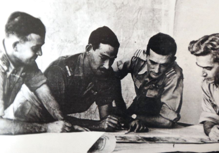 Harold ‘Smoky’ Simon (second left, inset) goes over plans with then-Israel Air Force commander Aharon Remez (left) and two unidentified serviceman during the War of Independence.