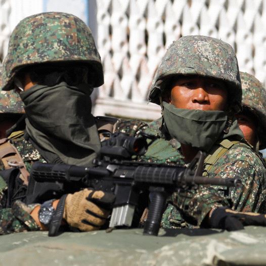 Members of Philippine Marines are pictured aboard a vehicle as more soldiers reinforce to fight the Maute group in Marawi City in southern Philippines May 29, 2017