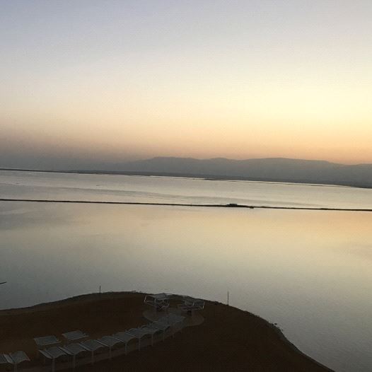 A view of the Dead Sea and Ein Bokek promenade at sunrise
