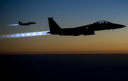 A pair of US Air Force F-15E Strike Eagles fly over northern Iraq after conducting airstrikes in Syria