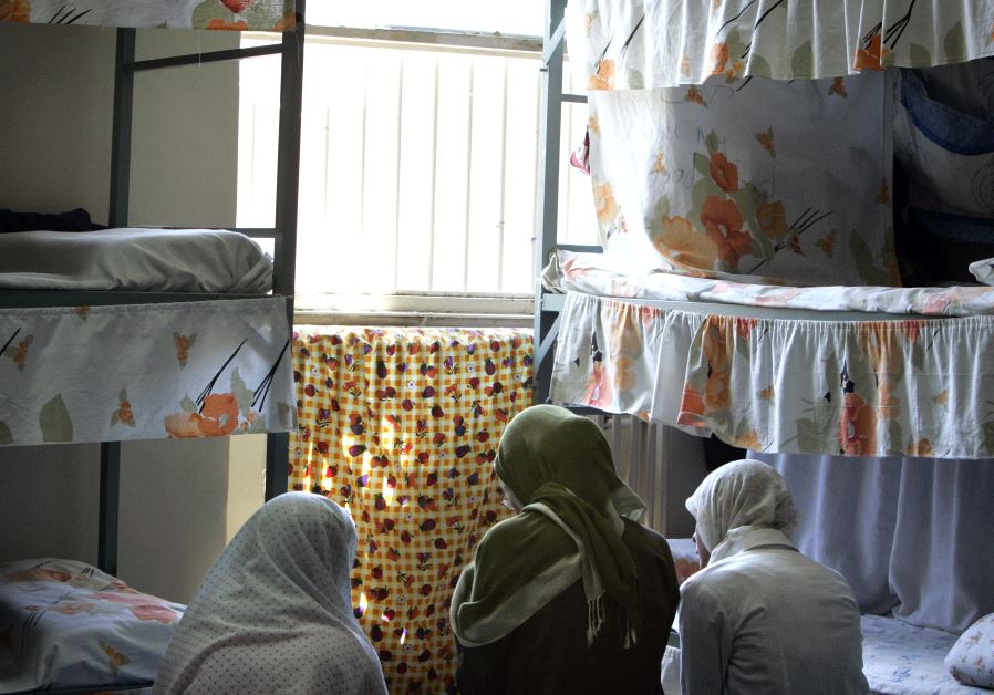 Iranian women prisoners sit at their cell in Tehran's Evin prison June 13, 2006.