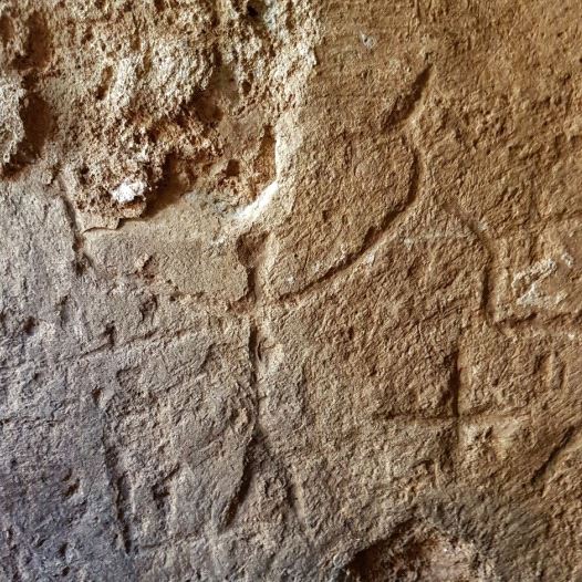 An ancient engraving of a human on the reservoir’s wall