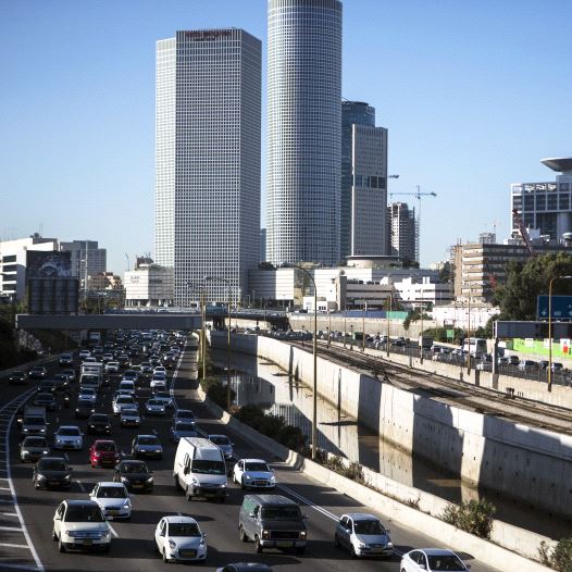 Vehicles drive on a highway in the central Israeli city of Tel Aviv December 17, 2013.