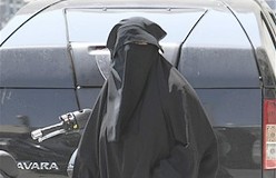 A woman wearing the niqab, a veil worn by the most conservative Muslims that exposes only a woman's eyes, walking in Marseille.