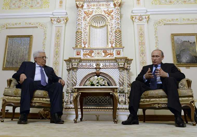 Russia's President Vladimir Putin speaks with Palestinian Authority President Mahmoud Abbas during their meeting at the Novo-Ogaryovo state residence outside Moscow June 25, 2014