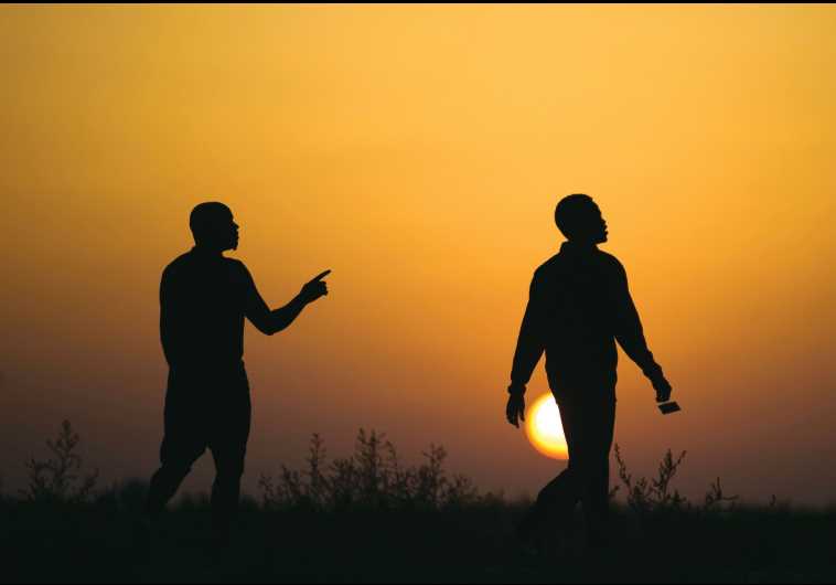 African migrants walk outside Holot open detention center in the southern Negev last year.