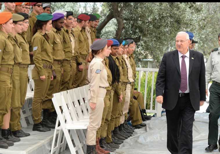 PRESIDENT REUVEN RIVLIN reviews this year’s 120 outstanding soldiers during a practice session at his Jerusalem residence yesterday in advance of Independence Day.