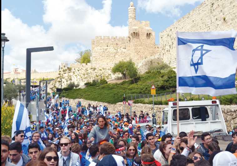 Thousands of young people participating in March of the Living walk from Safra Square to the Western Wall on April 23, 2015
