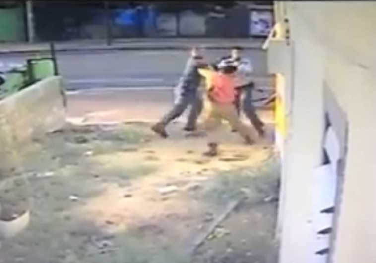 Screenshot of video showing police officer attacking IDF soldier‏.