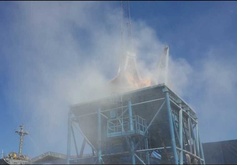 A cloud of dust during unloading at the Haifa port