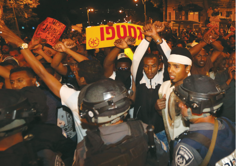 ETHIOPIAN ISRAELIS march in a protest against police brutality and racism in Jerusalem on Thursday.