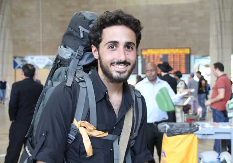 Omri Kadoch at Ben Gurion International Airport on Sunday, right after he landed from Nepal