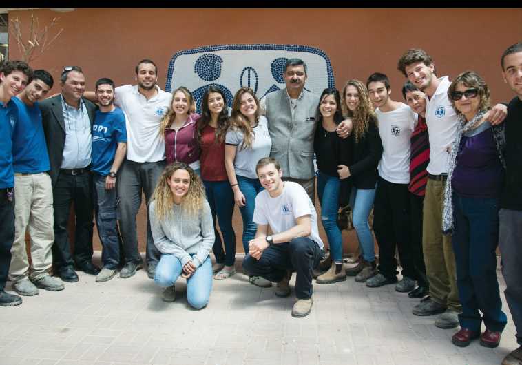 Siddartha Kaul (center) with staff and students at Kfar Neradim.