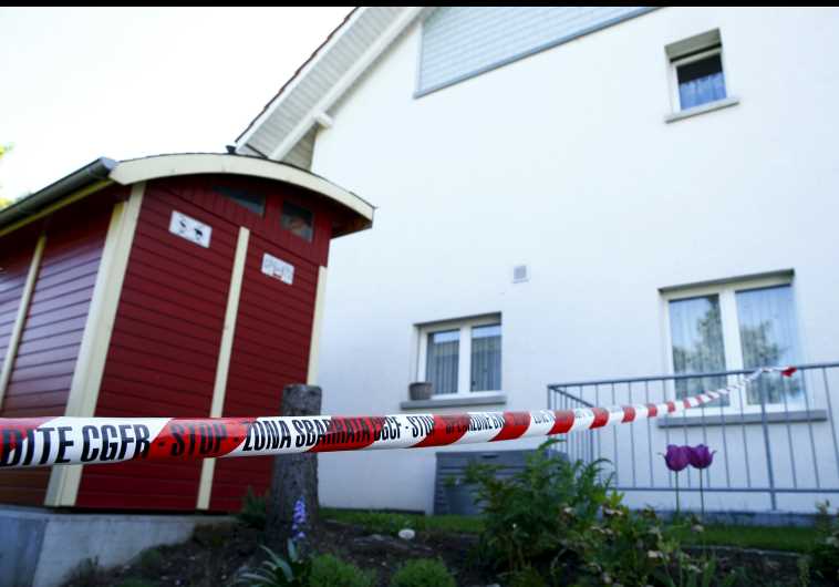 A police ribbon is seen in front of a house in Wuerenlingen, Switzerland May 10, 2015.