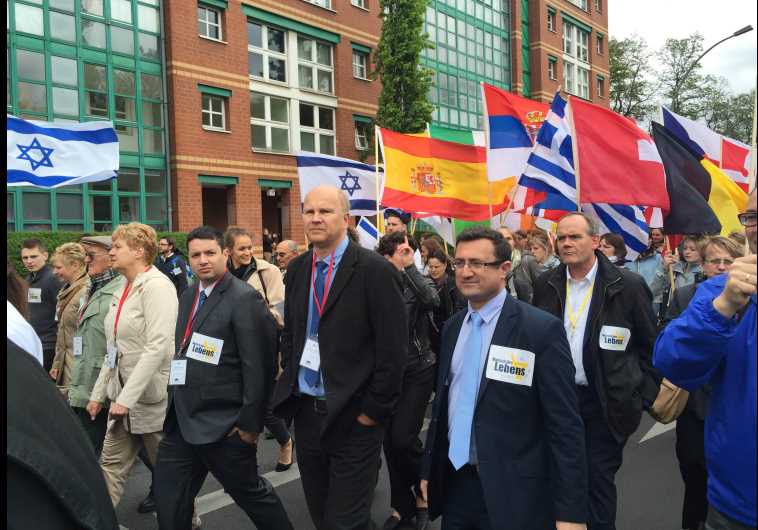 Knesset Christian Allies Caucus director Josh Reinstein marches with March of Life founder Jobst Bittner and caucus head MK Robert Ilatov (l-r) at the Berlin March of Life