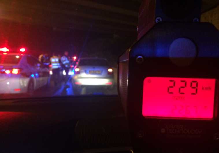 Speed gun showing 229 kilometers per hour on a Tel Aviv highway