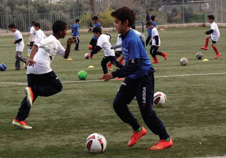 Children playing soccer (file)