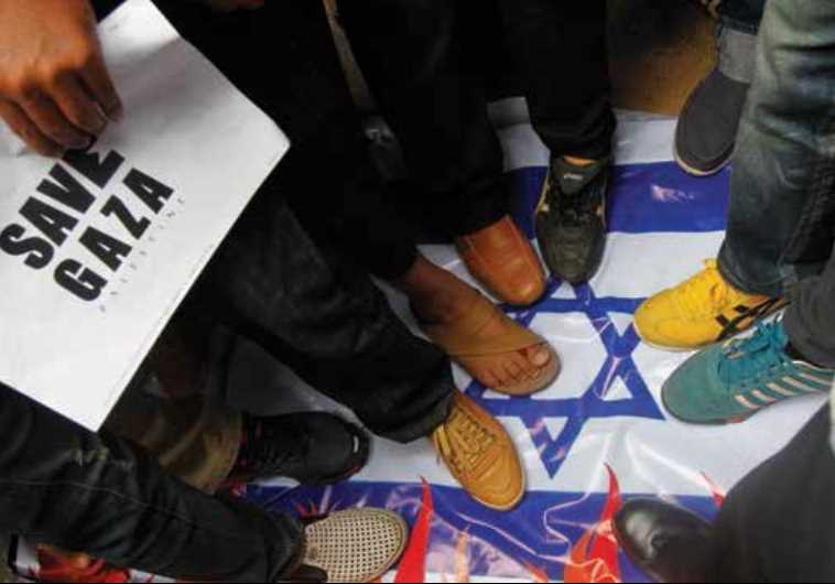 Demonstrators step on the national flag during an anti-Israel protest in front of the Israeli Embassy in Bangkok last year.
