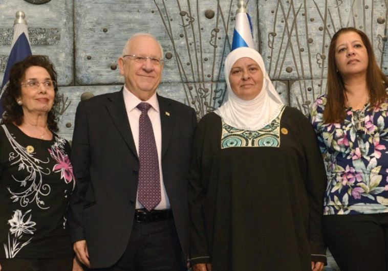 President Reuven Rivlin stands with family members of organ donors at an ADI - National Organ Transplant Center ceremony, May, 2015